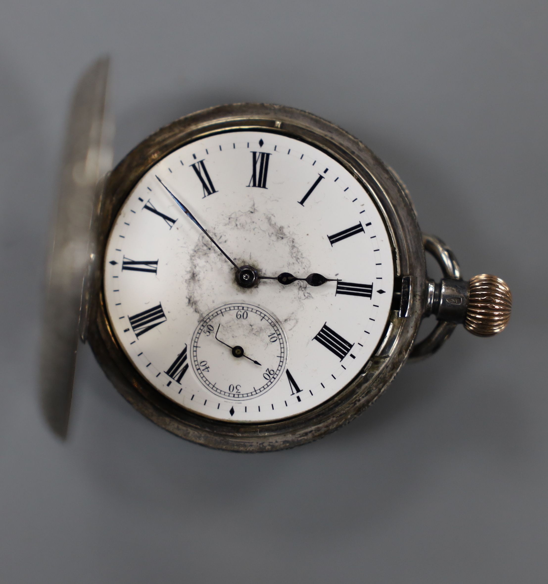 A 19th century silver pair cased half hunter keywind pocket watch, with two Roman dials, overall diameter 55mm, and a later engraved silver fob watch.